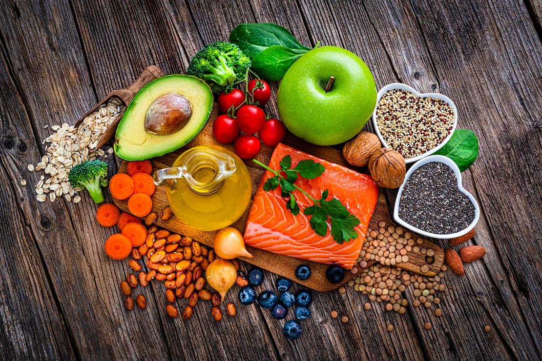 heart-healthy foods, including avocado, salmon, broccoli, grains and berries