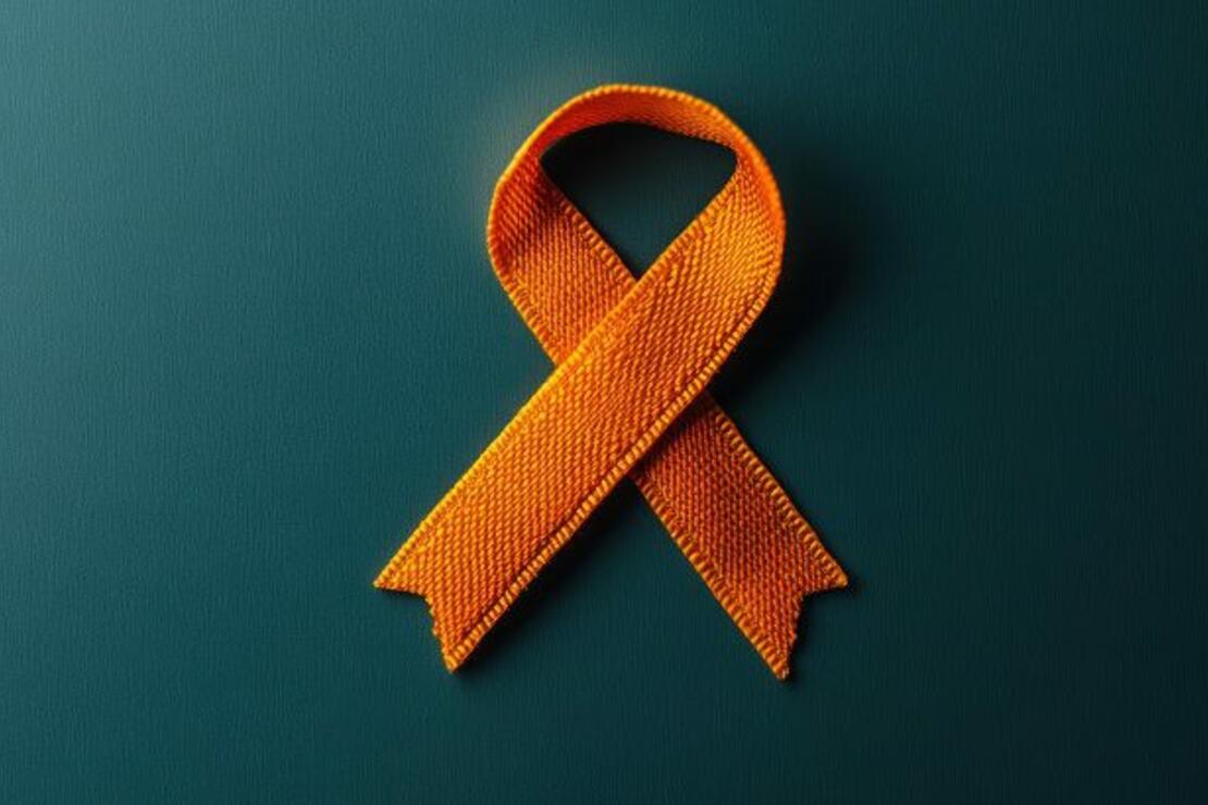 Orange ribbon on a dark background