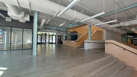 An interior shot of the new factory, featuring wide steps leading to an open space.