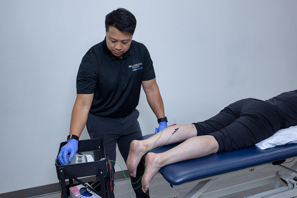 Patient and therapist reviewing a gait assessment