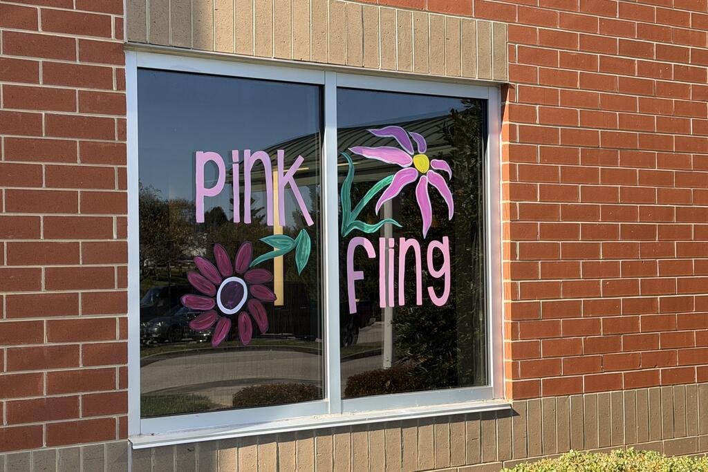 "Pink Fling" window art featuring flowers.