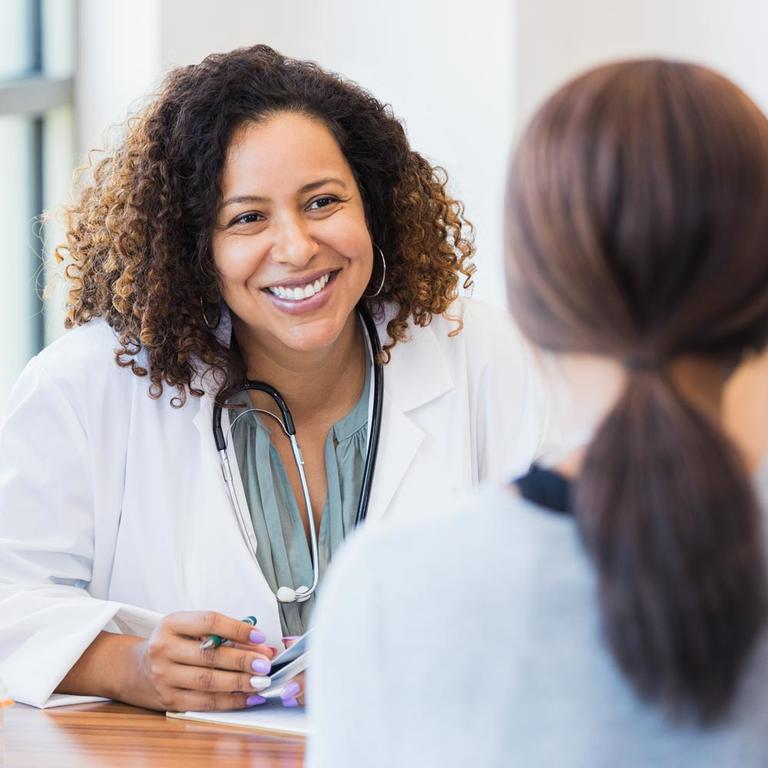 A doctor talking to a patient