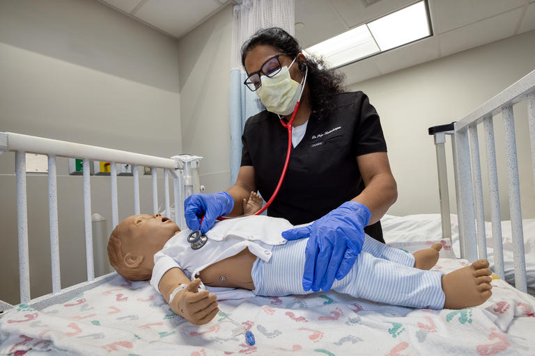 A student nurse working in the Simulation Center