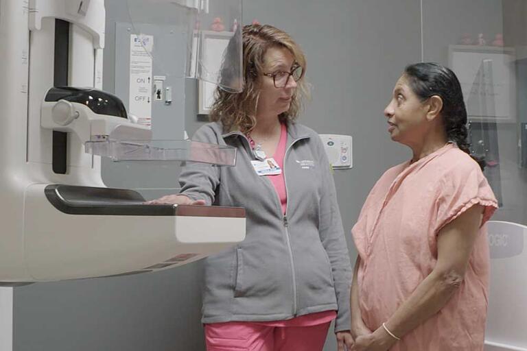 Woman preparing for a mammogram