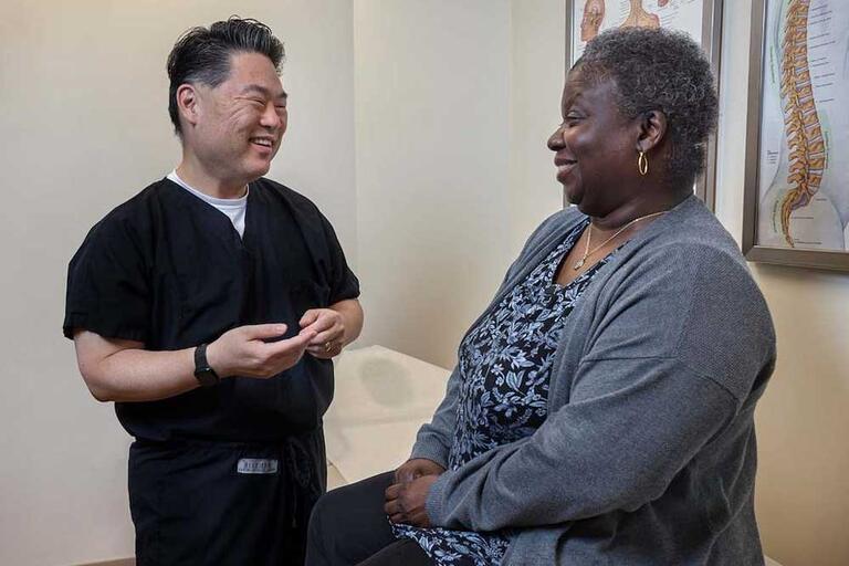 Woman talking to a rehab physician