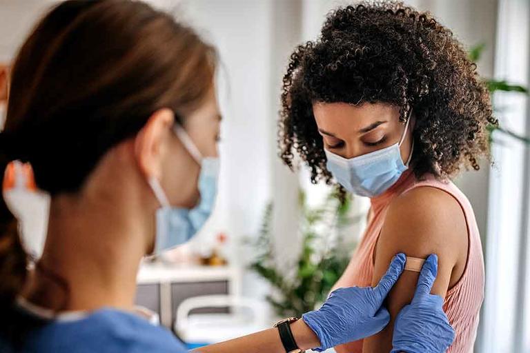 Doctor giving a patient a Covid vaccine