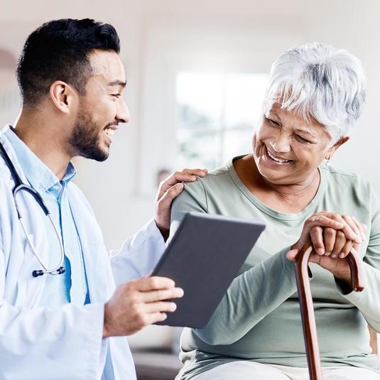 A doctor reviewing medical records with a patient