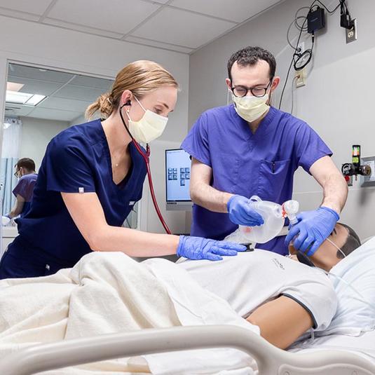 Students practicing in a simulation lab