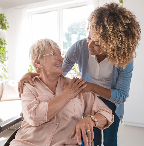 A volunteer helping a patient A volunteer helping a patient