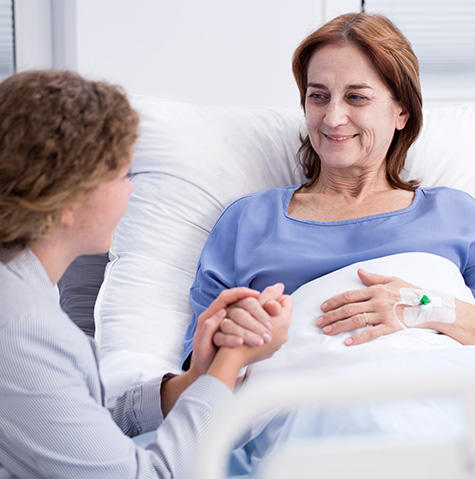 A volunteer helping a patient