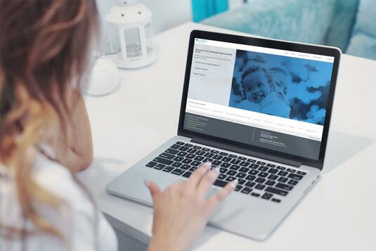 Person looking at laptop Person looking at laptop