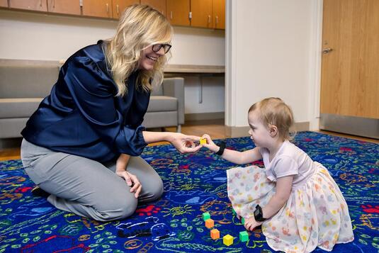 Dr. Wickstrom working with a young patient in the ABBEL research department Dr. Wickstrom working with a young patient in the ABBEL research department
