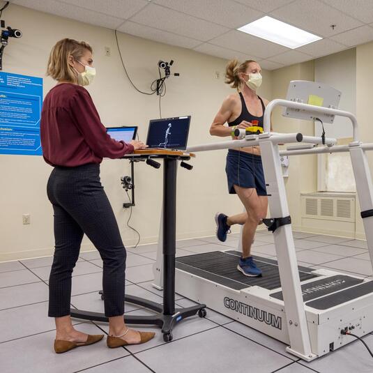 Doctor working with a patient to start running again Doctor working with a patient to start running again