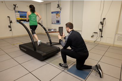 Doctor working with a patient to start running again