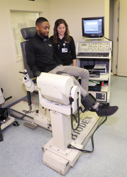 Person using the The Biodex Dynamometer Person using the The Biodex Dynamometer