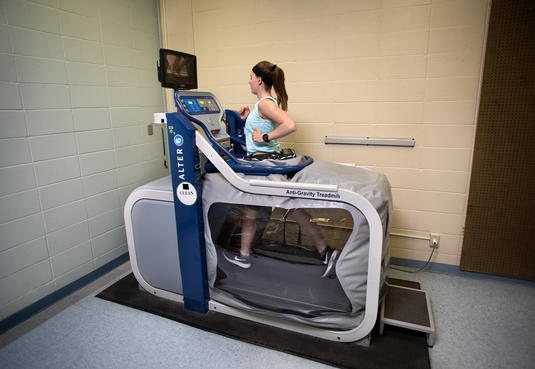 Person running on the anti-gravity-treadmill