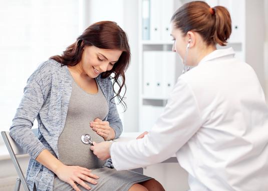 Pregnant women and her doctor at the diabetes resource center