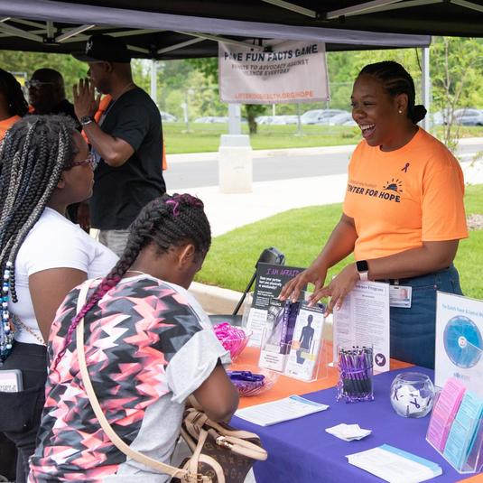 A volunteer talking with community members