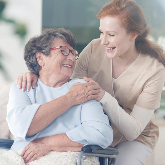 A volunteer helping a patient