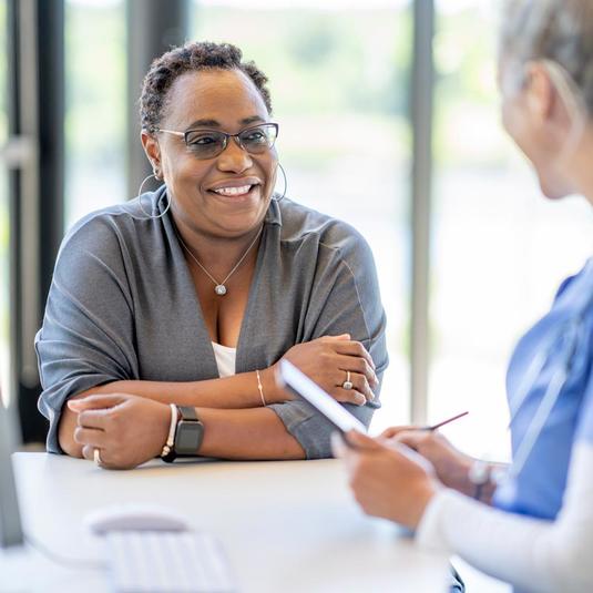 A research participant talking with a research Physician