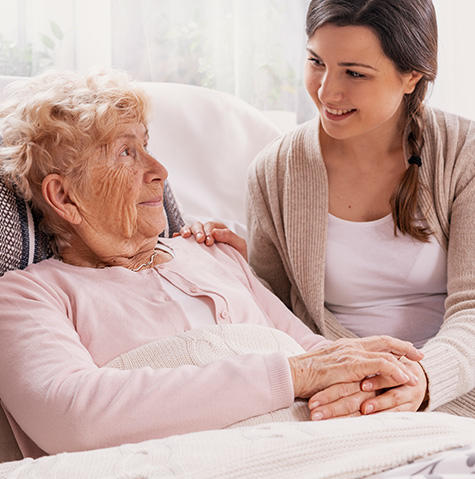 A volunteer helping a patient