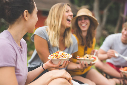 Friends having a picnic lunch