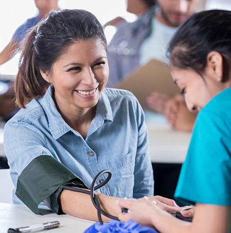 Patient getting her blood pressure checked Patient getting her blood pressure checked