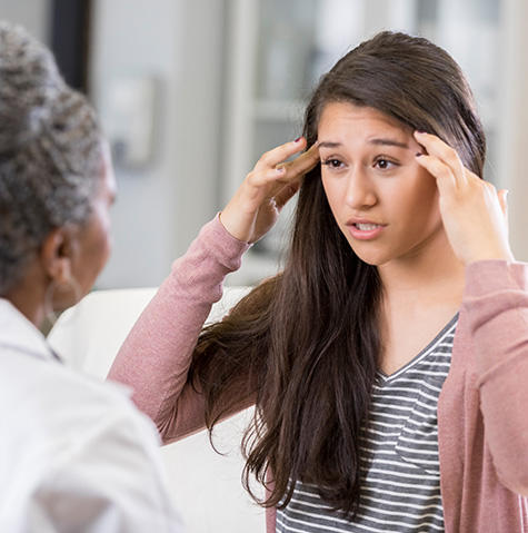 Patient showing the doctor her brain pain at the Brain and Spine Institute in Baltimore