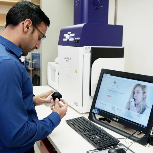 A person adjusting a custom-made medical device at the bioincubator