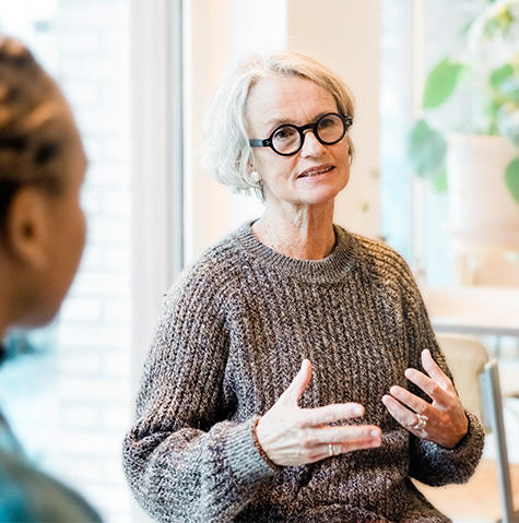 Women talking with a mental health professional at a psychiatry appointment in Baltimore