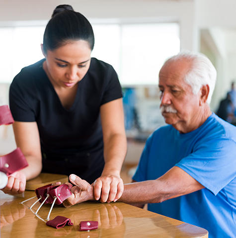 Doctor seeing an occupational therapist patient