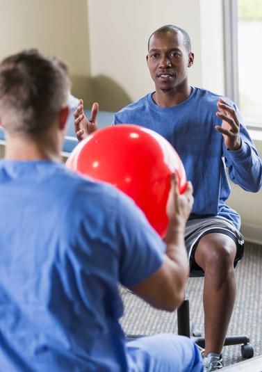 Doctor seeing an occupational therapist patient