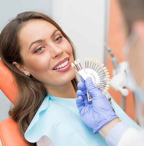 Patient getting a teeth implant Patient getting a teeth implant