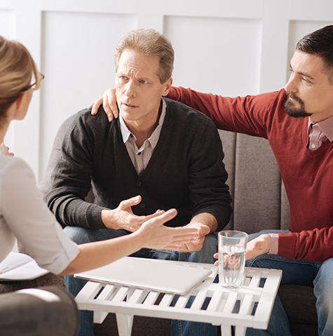 Man getting support from his doctor