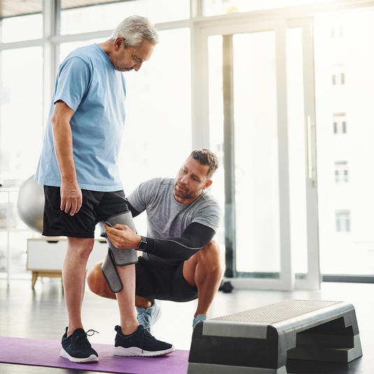 Doctor working on knee therapy