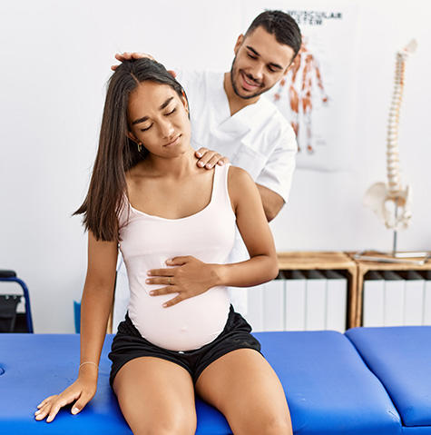 Pregnant woman with her physical therapist