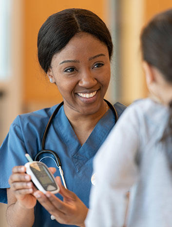 Women and her doctor reviewing diabetes tools